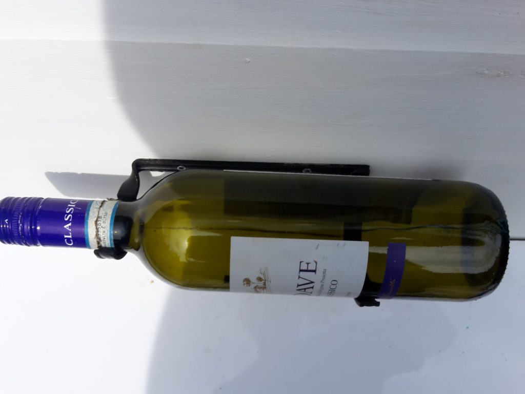 Wall mounted wine bottle holder
